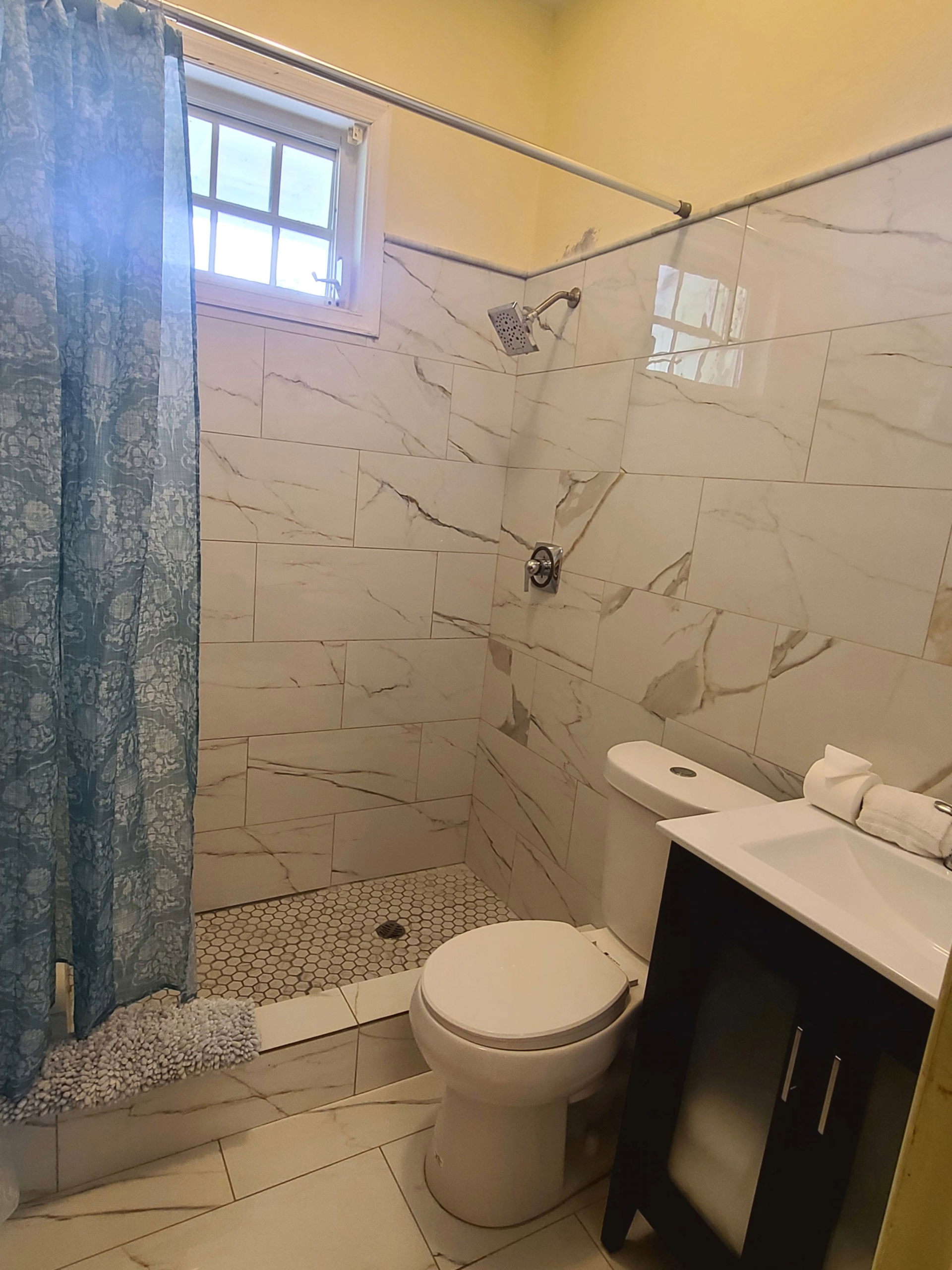Updated marble bathroom in a Boundless Bliss Hotel room
