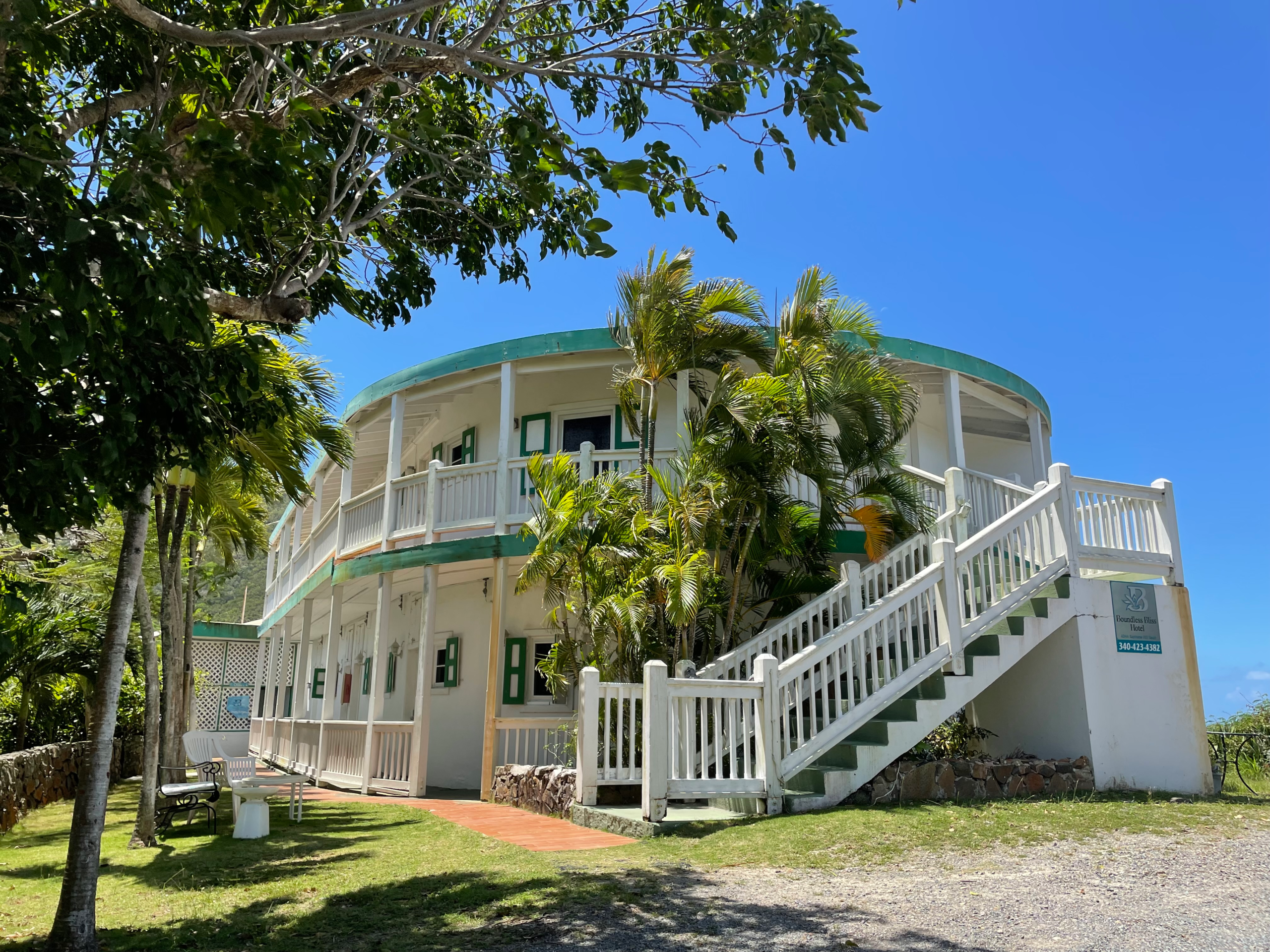 Historic exterior of Boundless Bliss Hotel, a restored century-old building in Charlotte Amalie, St. Thomas